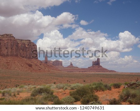 Iconic ground view of Monument Valley Mittens and Mesas over orange sand - Monument Valley Navajo Tribal Park - Arizona