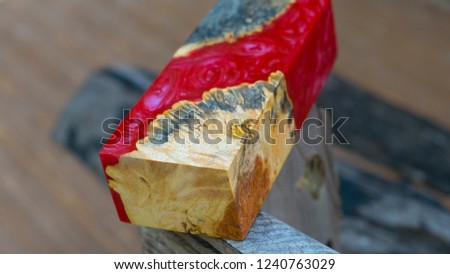 Epoxy resin Stabilizing Afzelia burl exotic wood red background, Abstract art picture photo, print design and your advertisement