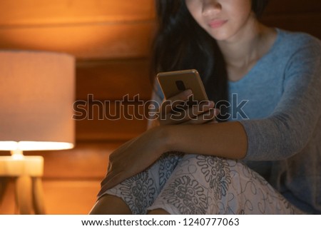 close up of woman with mobile phone at home. online browsing internet connetion concept