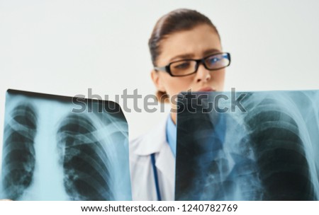 medical worker examining x-ray pictures                    