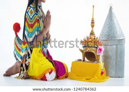 The lady is wearing Southern thai classical dancing suit ,sitting on background,to pay respect the Headdress