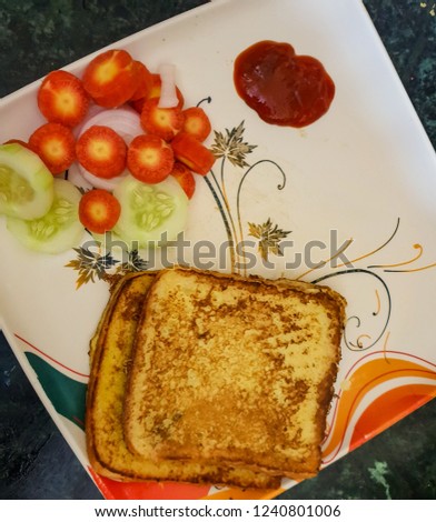 Breakfast in morning.french toast with vegetables and tomato sauce.Salad for breakfast.Bread fried in egg.Healthy morning breakfast.