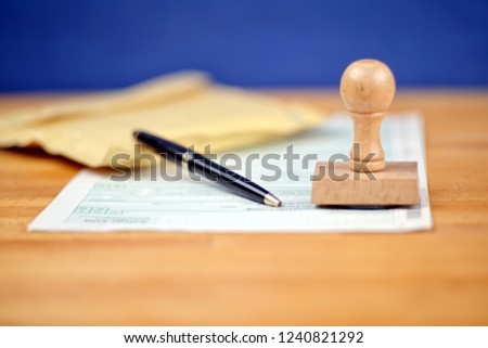 Office Desktop with a Stamp and letter conceptual picture 