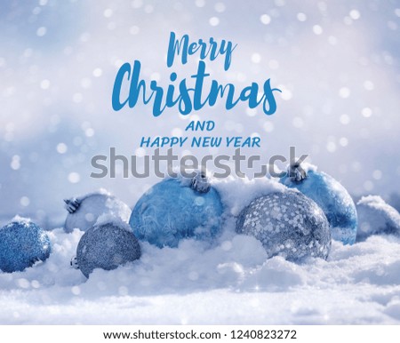 Merry Christmas and Happy New Year invitations, cards with blue and silver decoration. Christmas balls in  snow.  Copy space.