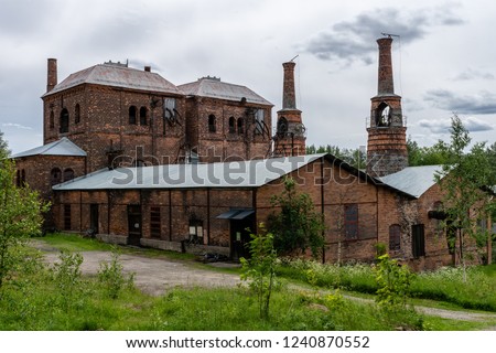 Old brick building with blast furnace from an old closed down steel mill or ironworks in Sweden Royalty-Free Stock Photo #1240870552