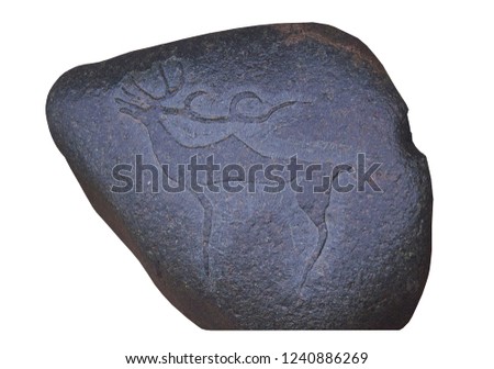 Ancient picture of deer at the Tamgaly National Petroglyph Park (Kazakhstan). Scythian symbol of sun. Bronze age. Isolated