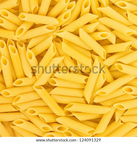 Italian Penne Rigate Macaroni Pasta raw food background or texture close up Royalty-Free Stock Photo #124091329