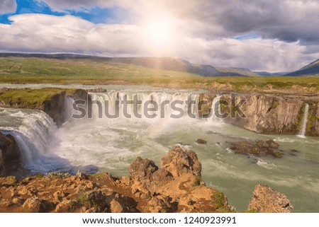 Godafoss (Akureyri) waterfall at sunny day, spectacular landscape of Iceland iconic place with blue cloudy sky. Skjalfandafljot river, Norðurland, North of Iceland