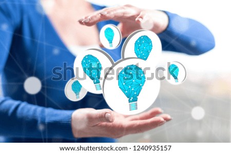 Innovation concept between hands of a woman in background