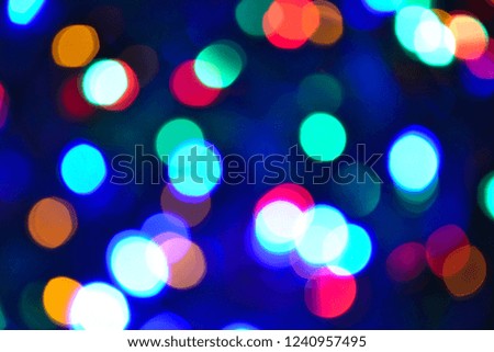 Bokeh. Christmas lights. Holiday background. Garland. Glitter. Defocused sparkles. Festive. New Year backdrop. Blinks. Carnival. Bokeh retro style photo. Multicolor. Colorful.