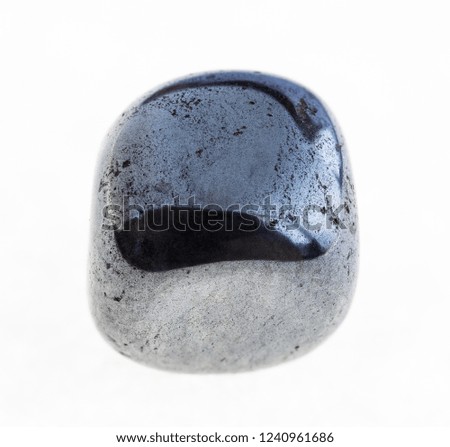 macro photography of natural mineral from geological collection - polished hematite gem stone on white background