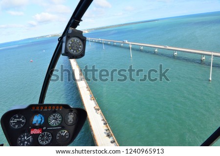 Looking through the screen of a helicopter at the Florida Keys