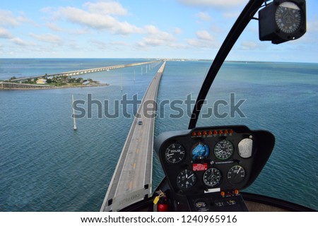 Looking through the screen of a helicopter at the Florida Keys