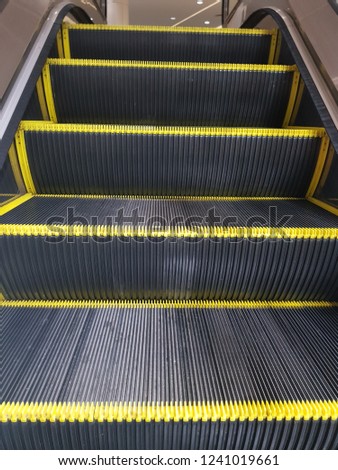 escalator photo at shopping mall