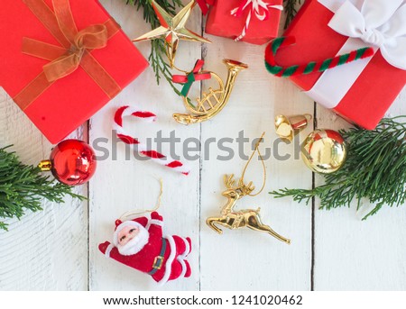Christmas decoration on white wood background . Red and gift box and decoration object .top view composition.