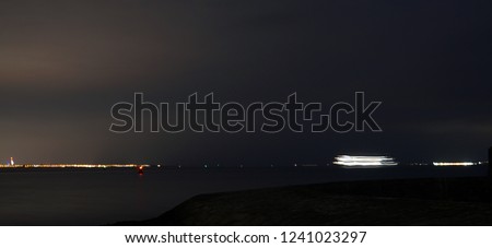 Night view of the sea, with a slow shutter speed.