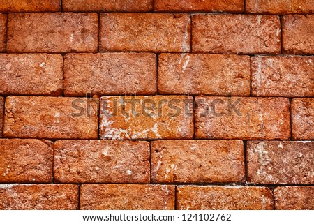 The wall of the old red brick close up - background