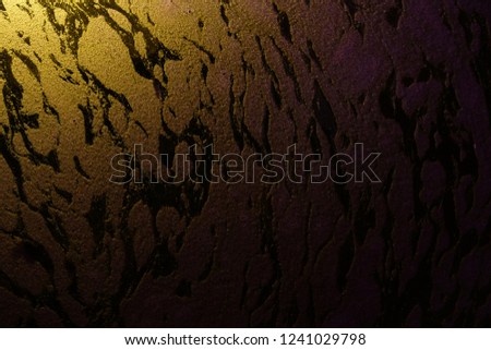 the texture of color on water and orange light