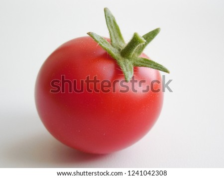 Tomato on a gray background.