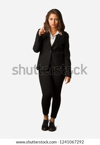 Full body young busines woman showing number one