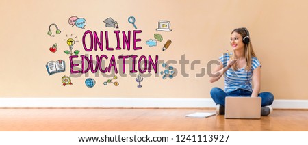 Online education with young woman with headphones using a laptop computer and a pencil