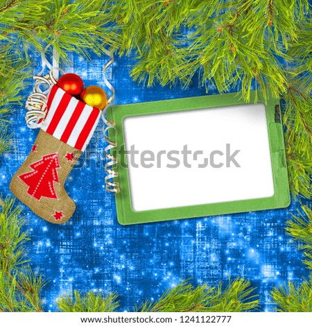 Santa Claus's New Year sock with gifts, toys and serpentine on  green background with pine
