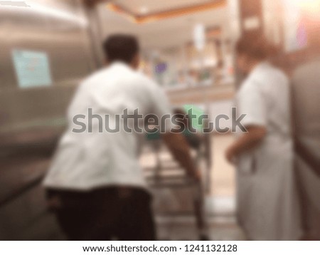 Defocused image, Medical worker and nurse moving patient, emergency room at hospital. Anonymous people lying on examination couch, wait for admit to the hospital.