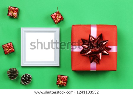 Christmas decoration equipment and photo frame on green paper art background with copy space for your design.