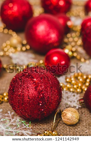 Red Christmas balls on the background of decorations