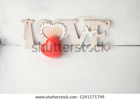 heart red and the inscription love on a white background