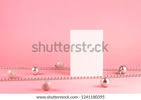Fashion ?hristmas decoration on pink background. Closeup of pink christmas balls and pink bead