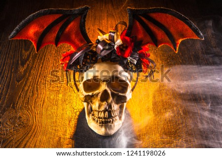 Skull. The skull is decorated with wings. Death. Feast of the dead. Halloween The wings of the bat.