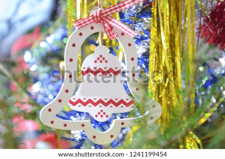 Decorated Christmas tree on blurred, sparkling and fairy background. ball, deer, bell, blur