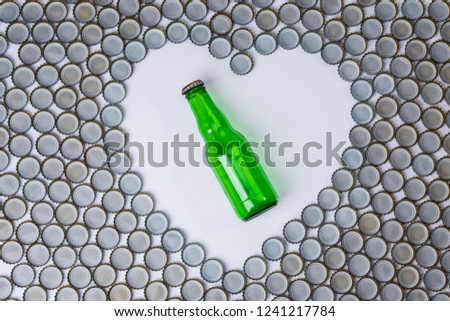 Glass bottle caps, green glass bottle in heart shape with text space