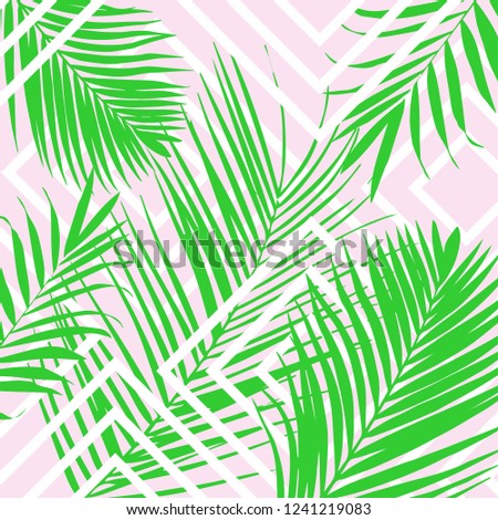 Vector tropical palm leaves on pink background