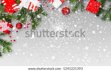 Noel flat lay composition with fir branches and red berries lying on a light wooden background covered with a snow,view from above, blank space for a text