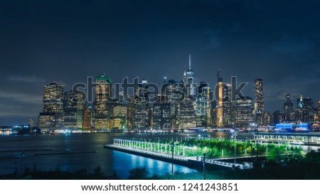 Aerial view and night panoramic of the skyline and the illuminations of Manhattan, in New York, from a viewpoint in New Jersey