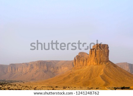 Tuwaiq Escarpment mountains in Riyadh near the red sand dunes