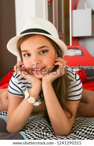 portrait of a young teen girl in a stylish hat