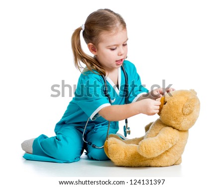 doctor girl playing and curing plush toy isolated on white background Royalty-Free Stock Photo #124131397