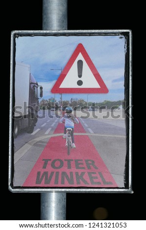 Attention sign with the German inscription: Blind Spot or Dead Corner (Toter Winkel) at the Bike Flash warning system to warn right-turning trucks - city of Garbsen, Hanover district, Germany