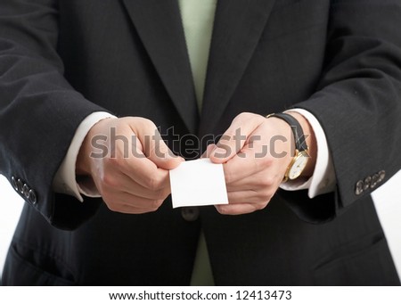 Japanese manner of man's hands presenting buiness card