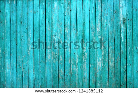 Turquoise barn wooden board wall. Old blue planking texture. Painted grunge hardwood background surface