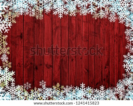 Wooden red Christmas background with snowflakes