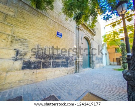 A photo of the wall of the Torres de Quart o Puerta de Quart which are medieval gothic gates. The towers are located in the Guillen de Castro and Quart streets, in the city of Valencia, Spain, Europe.