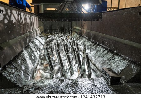 Galvanizing metallic structures in a zinc bath Royalty-Free Stock Photo #1241432713