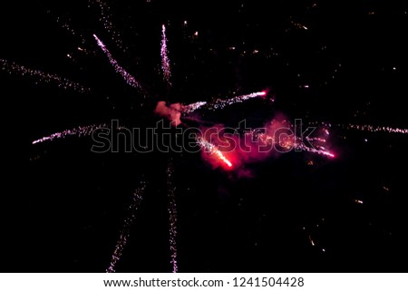Fireworks exploding burst on night sky and bright light on dark night
