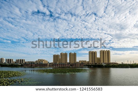 Blue sky and white clouds over the city park, take pictures at sunset