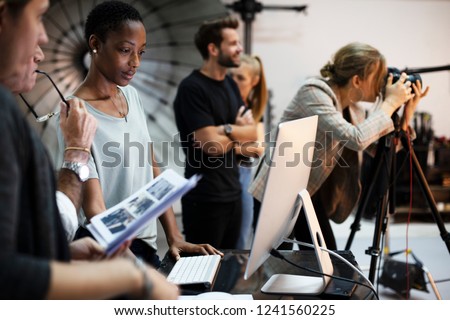 Art director checking the photos on a monitor