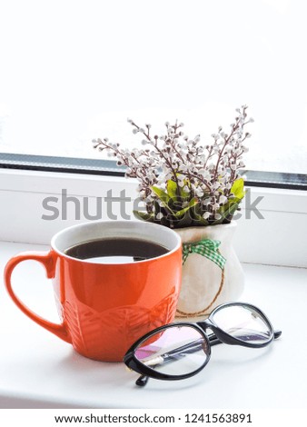 Orange cup of coffee on white  background with glasses. Flat lay style.Break time Coffee Cup Concept.Office workers having a coffee break. top view. Having a break.Christmas holidays background.
